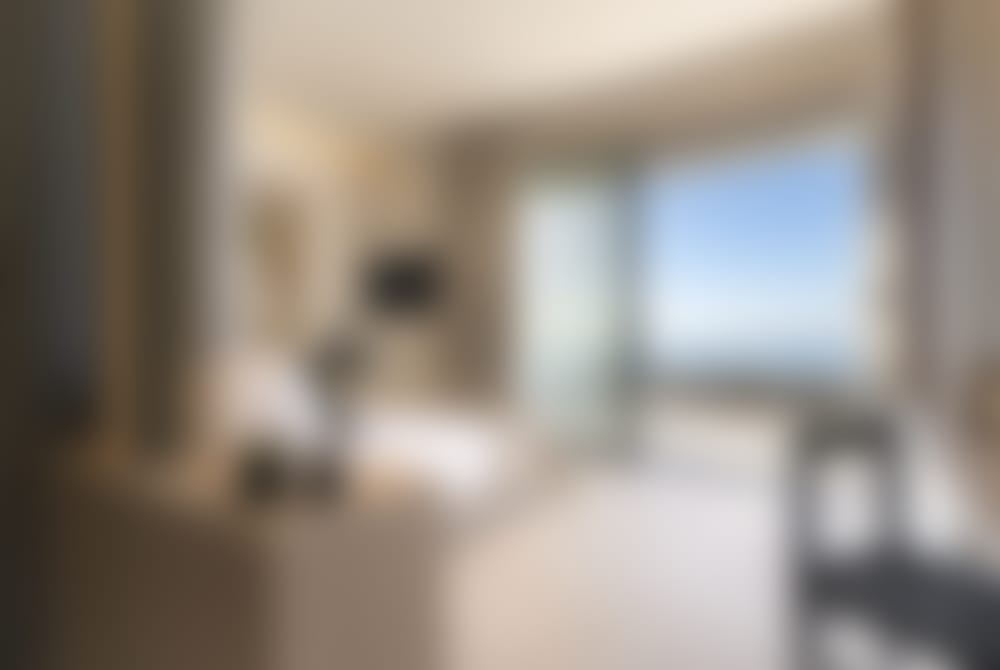 The spacious double bedroom accessed from the living area with its sea views and terrace access. (Bedroom 1)